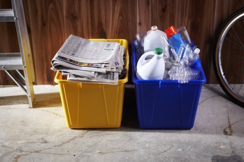 Worker putting on PPE before commercial waste collection